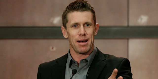 Carl Edwards speaks to the media during a news conference at Joe Gibbs Racing in Huntersville, N.C., Wednesday, Jan. 11, 2017. Edwards announced he was stepping away from racing. (AP Photo/Chuck Burton)