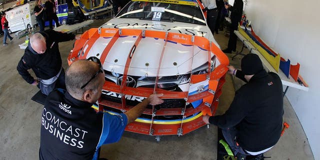 LOUDON, NH - SEPTEMBER 25: The car of Carl Edwards, driver of the #19 Comcast Business Toyota, goes through pre-race inspection prior to the NASCAR Sprint Cup Series Bad Boy Off Road 300 at New Hampshire Motor Speedway on September 25, 2016 in Loudon, New Hampshire. (Photo by Jerry Markland/Getty Images)