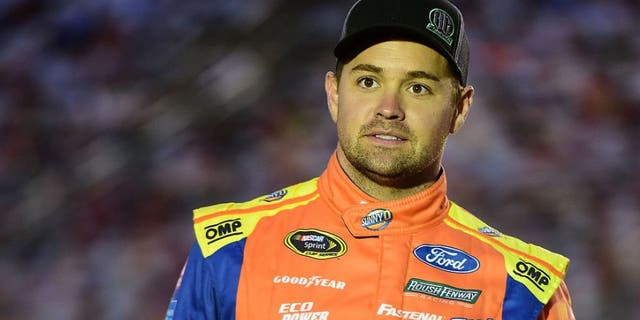 CHARLOTTE, NC - OCTOBER 06: Ricky Stenhouse Jr, driver of the #17 SunnyD Ford, stands on the grid during qualifying for the NASCAR Sprint Cup Series Bank of America 500 at Charlotte Motor Speedway on October 6, 2016 in Charlotte, North Carolina. (Photo by Jared C. Tilton/NASCAR via Getty Images)