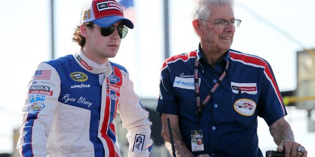 DARLINGTON, SC - SEPTEMBER 04: Ryan Blaney, driver of the #21 Motorcraft/Quick Lane Tire & Auto Center Ford, rides with NASCAR Hall of Famer Leonard Wood during pre-race festivities for the NASCAR Sprint Cup Series Bojangles' Southern 500 at Darlington Raceway on September 4, 2016 in Darlington, South Carolina. (Photo by Jerry Markland/Getty Images)