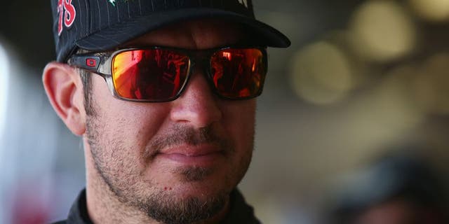 DAYTONA BEACH, FL - JULY 01: Martin Truex Jr., driver of the #78 Bass Pro Shops/Tracker Boats Toyota, stands in the garage area during practice for the NASCAR Sprint Cup Series Coke Zero 400 at Daytona International Speedway on July 1, 2016 in Daytona Beach, Florida. (Photo by Sarah Crabill/NASCAR via Getty Images)