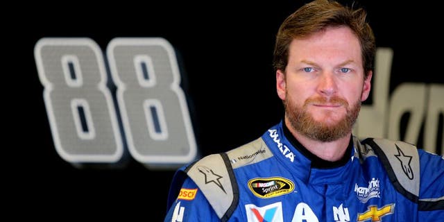 DAYTONA BEACH, FL - JUNE 30: Dale Earnhardt Jr., driver of the #88 Nationwide Chevrolet, stands in the garage area during practice for the NASCAR Sprint Cup Series Coke Zero 400 at Daytona International Speedway on June 30, 2016 in Daytona Beach, Florida. (Photo by Jerry Markland/Getty Images)