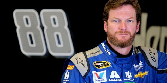 DAYTONA BEACH, FL - JUNE 30: Dale Earnhardt Jr., driver of the #88 Nationwide Chevrolet, stands in the garage area during practice for the NASCAR Sprint Cup Series Coke Zero 400 at Daytona International Speedway on June 30, 2016 in Daytona Beach, Florida. (Photo by Jerry Markland/Getty Images)