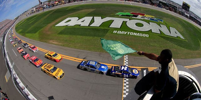 DAYTONA BEACH, FL - FEBRUARY 21: Ken Griffey Jr waves the green flag as Chase Elliott, driver of the #24 NAPA Auto Parts Chevrolet, leads the field to start the NASCAR Sprint Cup Series DAYTONA 500 at Daytona International Speedway on February 21, 2016 in Daytona Beach, Florida. (Photo by Chris Trotman/NASCAR via Getty Images)