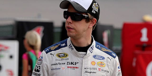 HOMESTEAD, FL - NOVEMBER 19: Brad Keselowski, driver of the #2 Miller Lite Ford, walks through the garage area during practice for the NASCAR Sprint Cup Series Ford EcoBoost 400 at Homestead-Miami Speedway on November 19, 2016 in Homestead, Florida. (Photo by Jerry Markland/Getty Images)