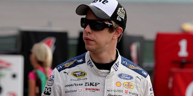 HOMESTEAD, FL - NOVEMBER 19: Brad Keselowski, driver of the #2 Miller Lite Ford, walks through the garage area during practice for the NASCAR Sprint Cup Series Ford EcoBoost 400 at Homestead-Miami Speedway on November 19, 2016 in Homestead, Florida. (Photo by Jerry Markland/Getty Images)