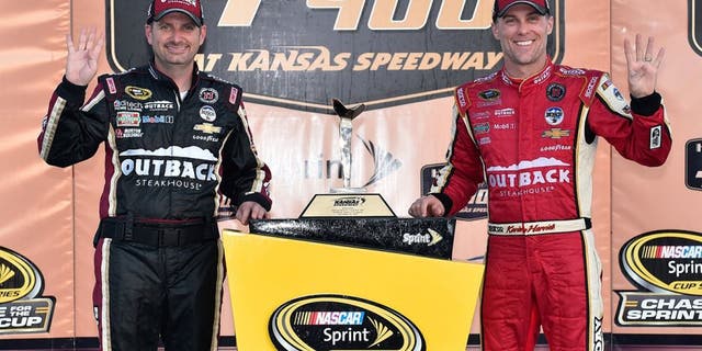 KANSAS CITY, KS - OCTOBER 16: Kevin Harvick, driver of the #4 Outback Chevrolet, and crew chief Rodney Childers pose with the trophy after winning the NASCAR Sprint Cup Series Hollywood Casino 400 at Kansas Speedway on October 16, 2016 in Kansas City, Kansas. (Photo by Jason Hanna/Getty Images)