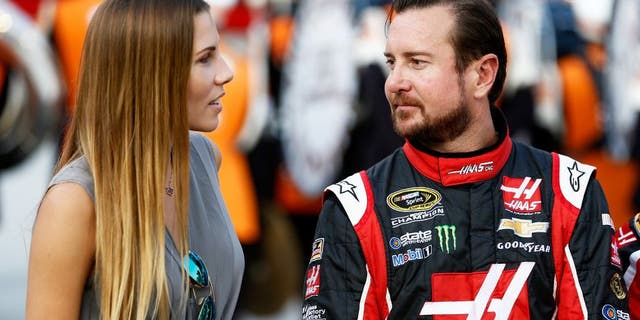 BRISTOL, TN - AUGUST 22: Kurt Busch, driver of the #41 Haas Automation Chevrolet, talks to his girlfriend, Ashley Van Metre, prior to the NASCAR Sprint Cup Series IRWIN Tools Night Race at Bristol Motor Speedway on August 22, 2015 in Bristol, Tennessee. (Photo by Jeff Zelevansky/Getty Images)
