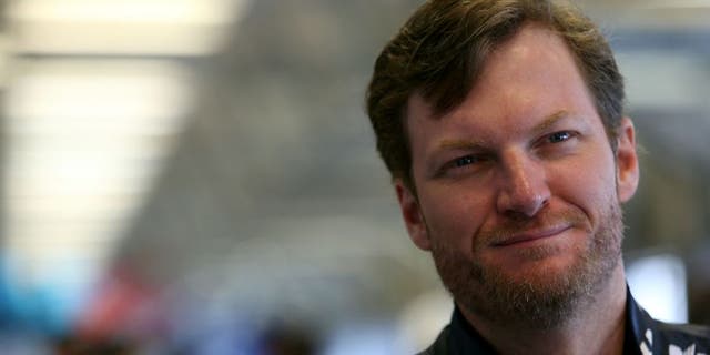 SPARTA, KY - JULY 08: Dale Earnhardt Jr., driver of the #88 Nationwide Chevrolet, stands in the garage area during practice for the NASCAR Sprint Cup Series Quaker State 400 at Kentucky Speedway on July 8, 2016 in Sparta, Kentucky. (Photo by Matt Hazlett/Getty Images)
