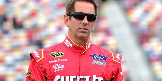 CHARLOTTE, NC - MAY 21: Greg Biffle, driver of the #16 Cheez-It Ford, walks on the grid prior to the NASCAR Sprint Cup Series Sprint Showdown at Charlotte Motor Speedway on May 21, 2016 in Charlotte, North Carolina. (Photo by Jared C. Tilton/Getty Images)