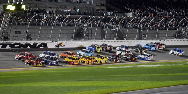 Feb 13, 2016; Daytona Beach, FL, USA; NASCAR Sprint Cup Series driver Jamie Mcmurray (1) and NASCAR Sprint Cup Series driver Kyle Larson (42) lead a pack of cars during The Sprint Unlimited at Daytona International Speedway. Mandatory Credit: Jasen Vinlove-USA TODAY Sports
