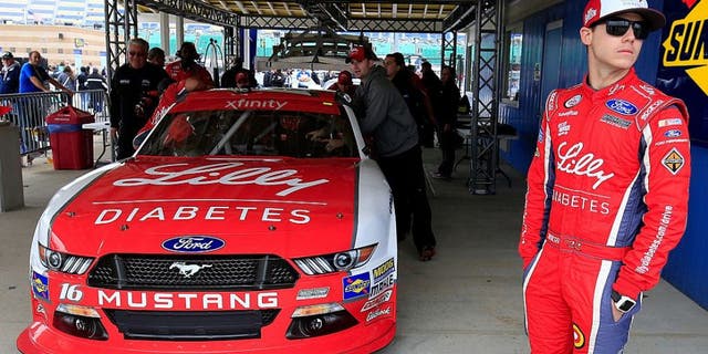 KANSAS CITY, KS - OCTOBER 15: Ryan Reed, driver of the #16 Lilly Diabetes/American Diabetes Association Ford, waits as his car is inspected by NASCAR officials prior to qualifying for the NASCAR XFINITY Series Kansas Lottery 300 at Kansas Speedway on October 15, 2016 in Kansas City, Kansas. (Photo by Chris Trotman/Getty Images)