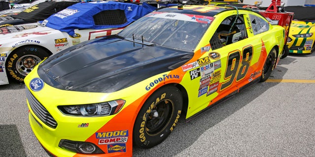 July 4, 2014: Josh Wise's car has a black-painted hood to cover a campaign ad for Florida Democratic gubernatorial candidate Charlie Crist before NASCAR Sprint Cup series qualifying at Daytona International Speedway in Daytona Beach, Fla. (AP)