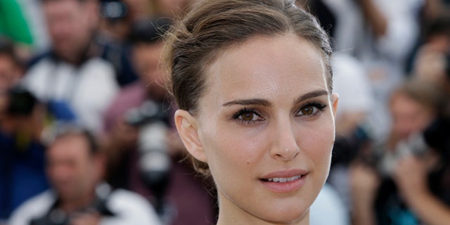 May 17, 2015 file photo, Natalie Portman poses for photographers during a photo call for the film "A Tale of Love and Darkness," at the 68th international film festival, Cannes, southern France.
