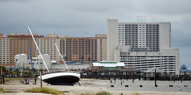 A sailboat beached near Margaritaville and the Golden Nugget in Biloxi, Miss., on Sunday, after Hurricane Nate made landfall.