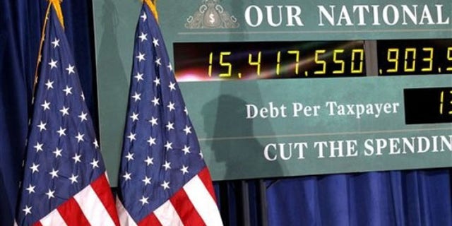 Feb. 24, 2012: A national debt clock is shown during a campaign event for Mitt Romney in Kalamazoo, Mich.