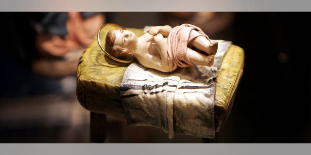 A baby Jesus figurine is part of a Nativity scene amid a "Joy to the World" exhibit on Dec. 9, 2004 in Washington, D.C. "He came, born of a virgin, full of grace and truth, to do what we could not," Pastor Lucas Miles said of Christ.