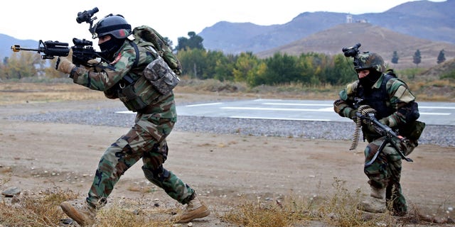 Nov. 6, 2014: Afghan special forces demonstrate their skills during the Secretary General of NATO, Jens Stoltenberg's first visit as head of NATO at the special forces training camp
