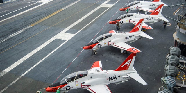 161210-N-EH855-008 ATLANTIC OCEAN (Dec. 10, 2016) Pilots perform pre-flight procedures in T-45C Goshawks from Training Air Wing One (TRAWING) 1 on the flight deck of the aircraft carrier USS George Washington (CVN 73). George Washington, homeported in Norfolk, is underway in the Atlantic Ocean. (U.S. Navy photo by Petty Officer 2nd Class Bryan Mai)