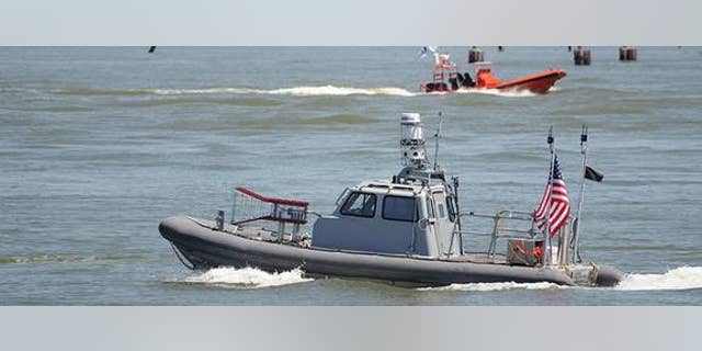 During a recent Navy exercise, unmanned boats, such as this rigid hulled inflatable boat, swarmed a simulated enemy without humans controlling them.
