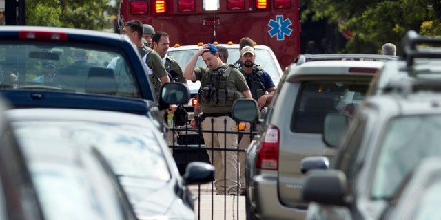 September 16, 2013: Heavily armed U.S. marshals walk from the Washington Navy Yard after a shooting by gunman Aaron Alexis.