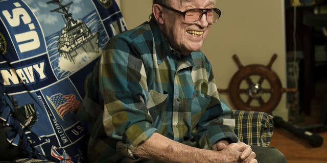 Retired Master Chief Lawrence J. Reilly Sr., a U.S. Navy veteran of World War II and the Vietnam War, who survived the 1969 ship collision that claimed the life of his son, and later fought unsuccessfully to have the victims' names inscribed on the Vietnam Veterans Memorial has died. He was 93. (Mike Greenlar /The Syracuse Newspapers via AP, File)