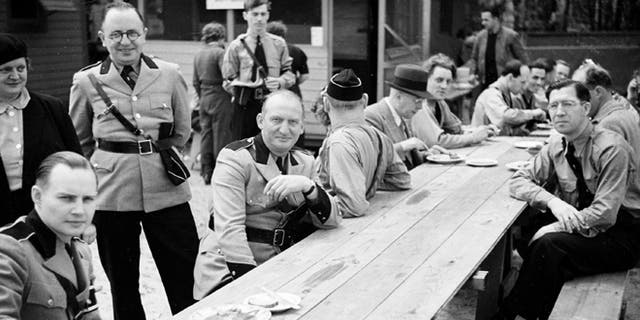 Members of the German American Bund pose for a photo at Camp Siegfried, in Yaphank, N.Y., in 1938.