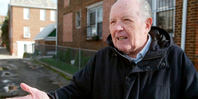 FILE - In this Nov. 20, 2003 file photo, Jakiw Palij, a former Nazi concentration camp guard, stands in front of a building in the Queens borough of New York. The White House says that Palij, a 95-year-old former Nazi concentration camp guard has been deported to Germany, 14 years after a judge ordered his expulsion. In a statement, the White House said the deportation of Palij, who lived in New York City, was carried out early Tuesday Aug. 21, 2018. (Suzanne DeChillo/The New York Times via AP, File)