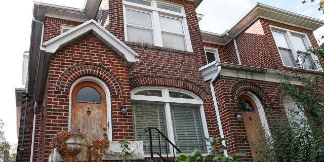 This Nov. 9, 2017 file photo shows the home, left, of former Nazi concentration camp guard Jakiw Palij, in the Jackson Heights neighborhood of the Queens borough of New York.
