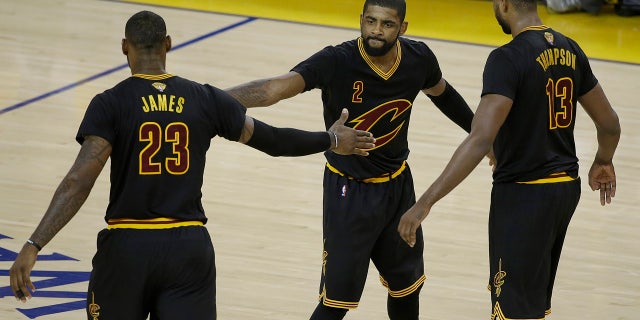 June 13, 2016: Cleveland Cavaliers guard Kyrie Irving (2), forward LeBron James (23) and center Tristan Thompson (13) react during the second half of Game 5 of the NBA Finals against the Golden State Warriors.