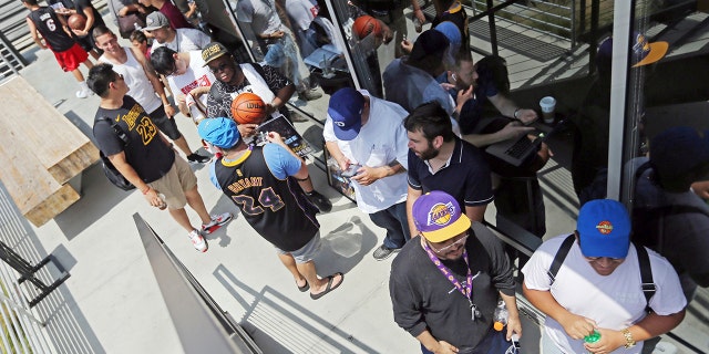 Los Angeles Lakers fans were already waiting in line around noon for promised free pizza that would be handed out between 2 and 5 p.m.