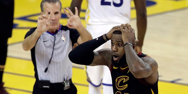 Cleveland Cavaliers forward LeBron James (23) reacts to a call during the second half of Game 1 of basketball's NBA Finals between the Golden State Warriors and the Cavaliers in Oakland, Calif.