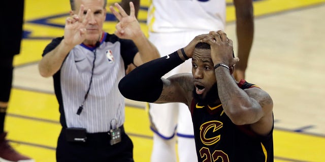 Cleveland Cavaliers forward LeBron James (23) reacts to a call during the second half of Game 1 of basketball's NBA Finals between the Golden State Warriors and the Cavaliers in Oakland, Calif.