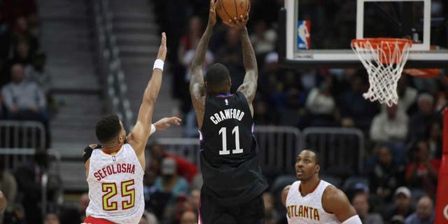 Jan 23, 2017; Atlanta, GA, USA; LA Clippers guard Jamal Crawford (11) shoots against Atlanta Hawks forward Thabo Sefolosha (25) in the fourth quarter of their game at Philips Arena. The Clippers won 115-105. Mandatory Credit: Jason Getz-USA TODAY Sports