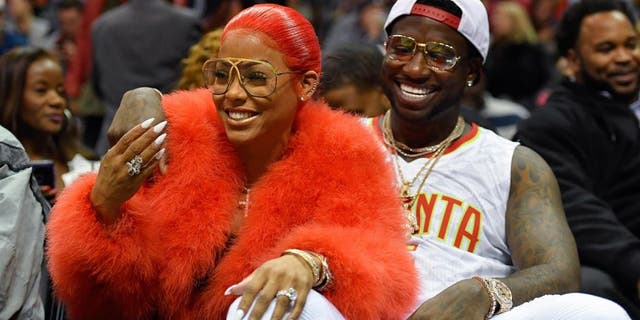 Nov 22, 2016; Atlanta, GA, USA; Recording artist Gucci Mane reacts with Keyshia Ka'oir after being engaged during a time out during the New Orleans Pelicans and Atlanta Hawks game during the second half at Philips Arena. The Pelicans defeated the Hawks 112-96.Mandatory Credit: Dale Zanine-USA TODAY Sports