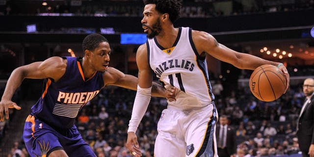 Feb 8, 2017; Memphis, TN, USA; Phoenix Suns guard Brandon Knight (11) guards Memphis Grizzlies guard Mike Conley (11) during the game at FedExForum. Memphis Grizzlies defeated the Phoenix Suns 110-91. Mandatory Credit: Justin Ford-USA TODAY Sports