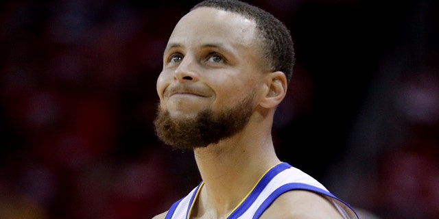 Golden State Warriors guard Stephen Curry reacts after getting called for a foul against the Houston Rockets in Game 5 of the NBA Western Conference finals in Houston, May 24, 2018.