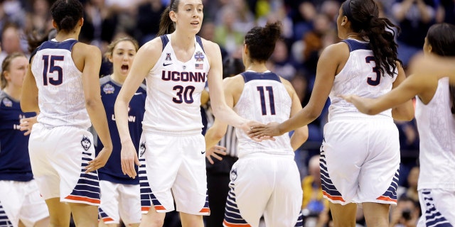 April 5, 2016: Connecticut's Breanna Stewart (30) greets teammates during a timeout during the first half of the NCAA women's basketball championship game against Syracuse in Indianapolis.