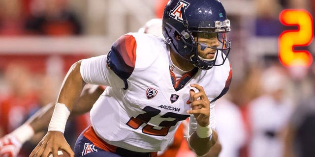 Oct 8, 2016; Salt Lake City, UT, USA; Arizona Wildcats quarterback Brandon Dawkins (13) runs with the ball during the first half against the Utah Utes at Rice-Eccles Stadium. Mandatory Credit: Russ Isabella-USA TODAY Sports