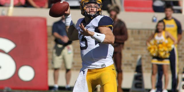 Oct 15, 2016; Lubbock, TX, USA; West Virginia Mountaineers quarterback Skyler Howard (3) prepares to make a throw against the Texas Tech Red Raiders in the first half at Jones AT&T Stadium. Mandatory Credit: Michael C. Johnson-USA TODAY Sports