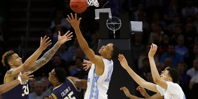 March 27, 2016: Notre Dame's Zach Auguste, far left, Bonzie Colson and North Carolina's Brice Johnson and Justin Jackson chase a rebound during the second half of the East Regional final in the men's NCAA basketball tournament in Philadelphia.