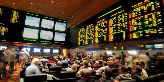 LAS VEGAS - MARCH 19: In this handout provided by the Las Vegas News Bureau, the Mirage Resort Race and Sports Book in Las Vegas is shown crowded with basketball fans during NCAA March Madness Tournament March 19, 2010. in Las Vegas, Nevada. (Photo by Glenn Pinkerton/Las Vegas News Bureau via Getty Images)