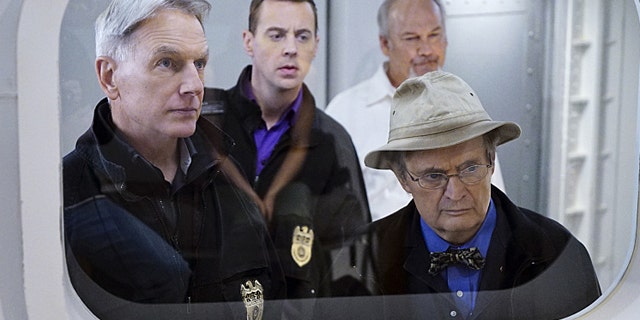 'Decompressed' -- When a deep sea diver is murdered on the job, his body and suspected co-workers must remain in a high-tech decompression chamber for four days, leaving the NCIS team to complete an unorthodox investigation from outside the tank. Pictured left to right: Mark Harmon, Sean Murray, Brett Rice and David McCallum (Sonja Flemming/CBS)