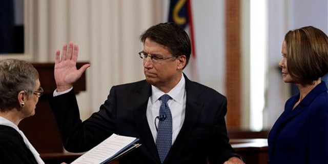 FILE: Jan. 5, 2013: Then-Gov.-elect Pat McCrory is sworn in as North Carolina governor in the House chamber of the old Capitol building in Raleigh, N.C.