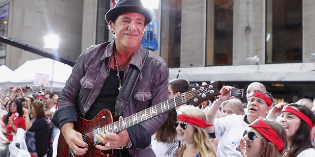 Guitarist Neal Schon performs with the band Journey on NBC's Today Show in New York July 29, 2011.