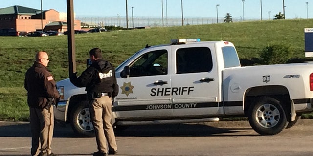 May 11, 2015: Members of the Johnson County Sheriff's Department stand outside the the Tecumseh State Correctional Institution in Tecomseh, Neb.