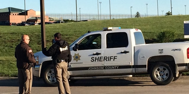 May 11, 2015: Members of the Johnson County Sheriff's Department stand outside the the Tecumseh State Correctional Institution in Tecomseh, Neb.