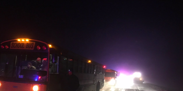 Buses from the Sidney Public Schools were brought in to assist in the rescue, authorities said.
