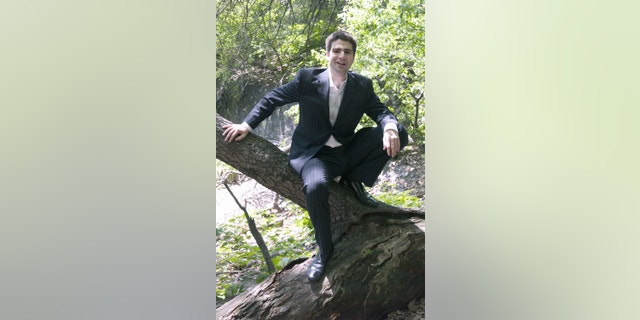 May 17, 2006. Author Ned Vizzini poses for a photo in New York's Central Park. Vizzini, a popular young adult author and television writer who wrote candidly and humorously about his struggles with depression, has committed suicide. He was 32.