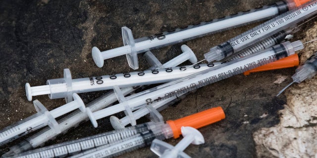 Discarded syringes are seen in an open-air heroin market that has thrived for decades outside the heart of Philadelphia, July 31, 2017.